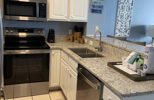 Navarre Beach Condo | Your Beach Escape with 3 Pools, 3 Hottubs, and Emerald Coast Beach Views!