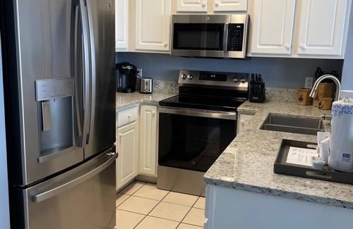 Navarre Beach Condo | Your Beach Escape with 3 Pools, 3 Hottubs, and Emerald Coast Beach Views!