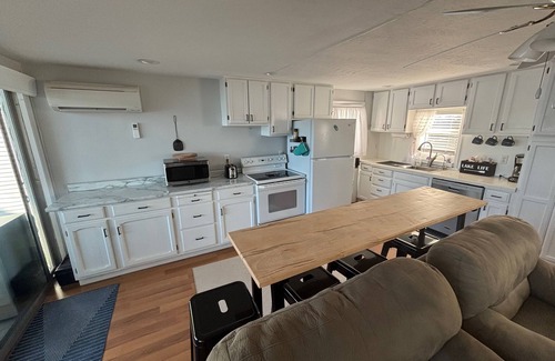 Edwardsburg House | Your Eagle Lake Escape: Dock, Deck, and Notre Dame Access.