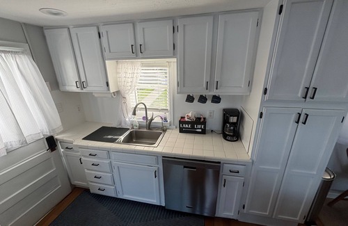 Edwardsburg House | Your Eagle Lake Escape: Dock, Deck, and Notre Dame Access.