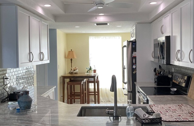 1st Floor Condo with community pool & 1 dedicated carport space