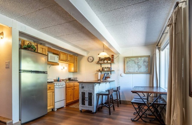 A bedroom alcove maximizes sleeping privacy in this condo.