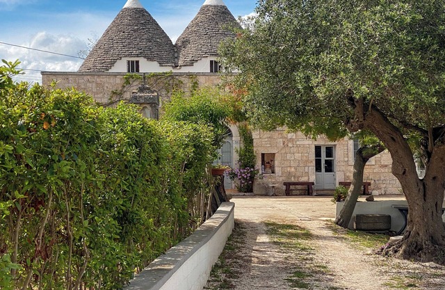 Ancient Trullo surrounded by greenery in the heart of Valle D'Itria