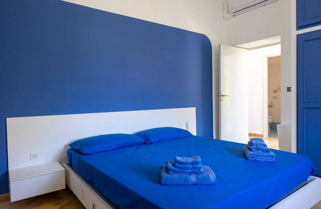 Apartment in portion of villa with solarium and beach.