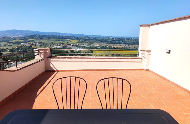 Apartment with large panoramic terrace in the center of the village.