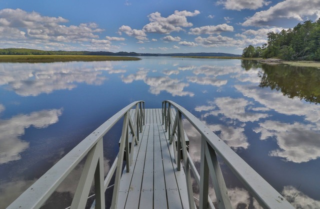 Bayfront home with gorgeous water views, dock, outdoor patio, fireplace