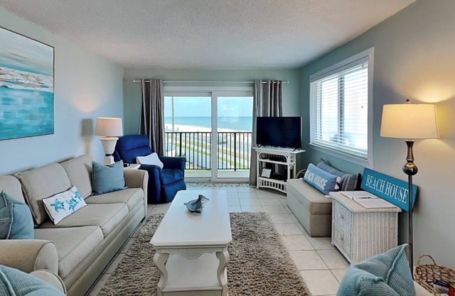Beach Front Condo with Balcony and Resort Amenities