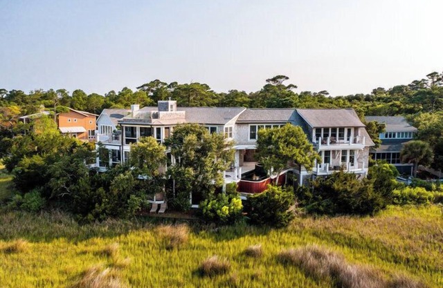 Beauitful marsh front, six bedroom home with infinity pool with hot tub.
