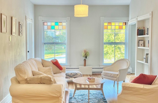 Beautiful, bright retreat with balcony overlooking river and rail trail.
