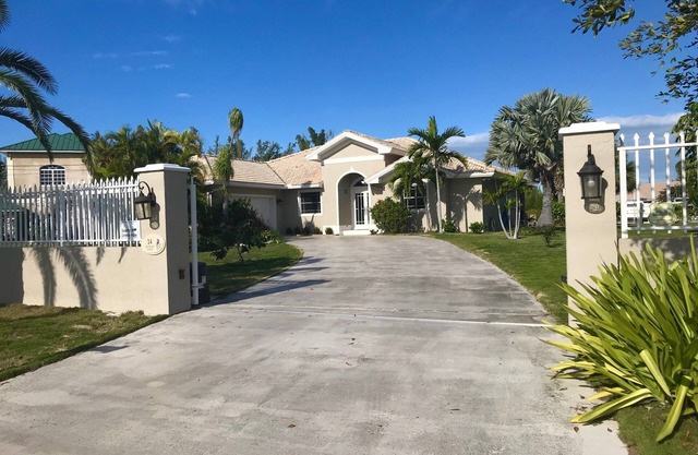 Beautiful Canal Front Gated Property With Pool!