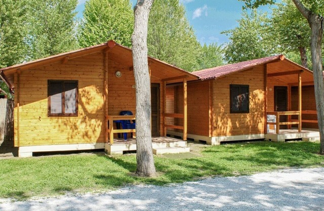 Beautiful wooden house with veranda and close to the beach.