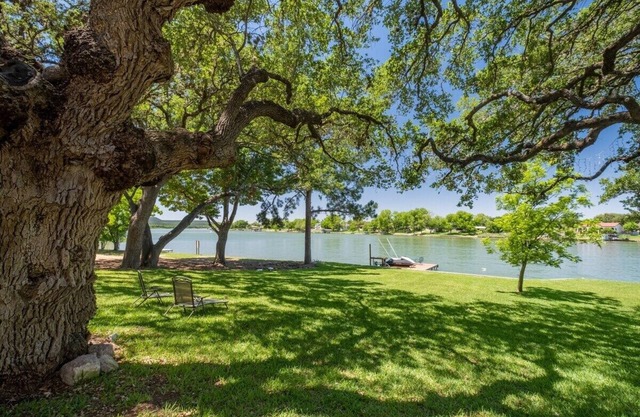 Burl Wood Cabin Lakefront w/Shaded Yard & Fishing