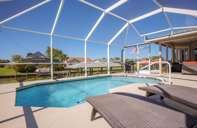 Canal-Front House With Covered Deck, Pool, Dock + Prime Location