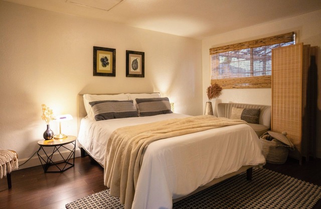 Charming 2-bedroom riverfront cottage! Enjoy a wood stove, W/D, and private hot tub overlooking the Rogue River. Perfect Gold Hill getaway for couples or a small family retreat.