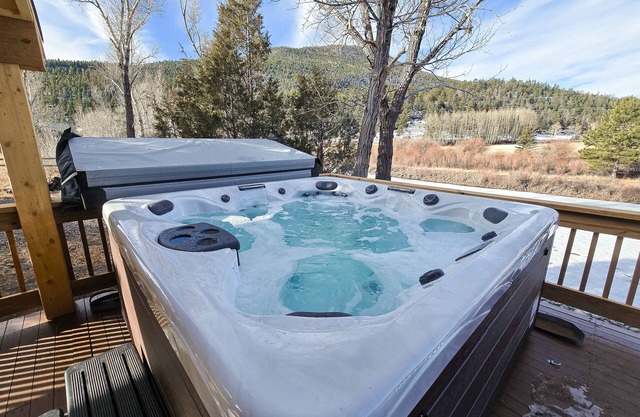 Charming riverfront cabin with hot tub, fireplace, and stunning outdoor views