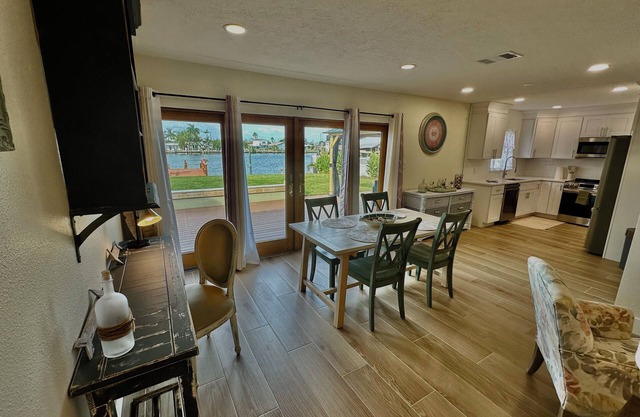 Coastal Charm, Waterfront 3BR Home with Dock & Walk-to-Beach Access