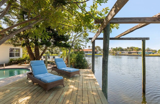 Coconut cove - peaceful garden retreat with HEATED pool on canal near the beach!