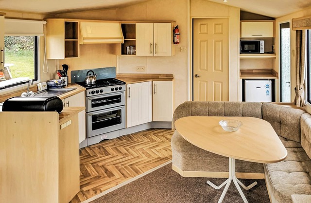 Comfortable and spacious 12ft-wide caravan with one double and one twin.