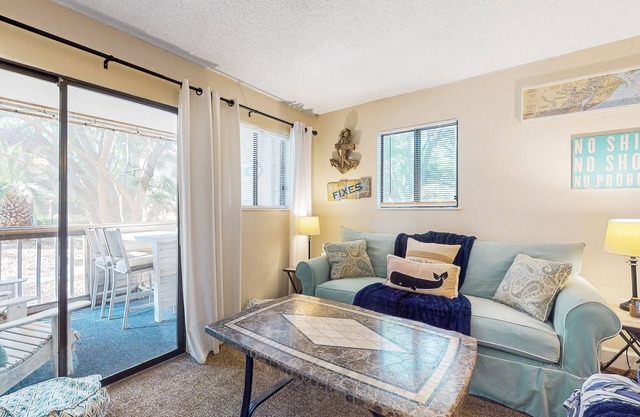 Condo by the beach with heated pools, hot tub, patio, tennis, central AC, & W/D