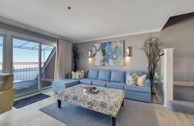 Condo with Lake Charlevoix Views | Private Beach Access | Gas-Log Fireplace