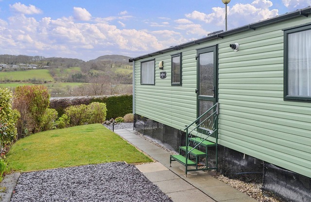 Contemporary, stylish caravan with one double and one twin.