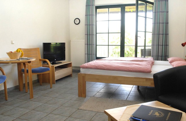cozy apartment with a large balcony on a modern horse farm