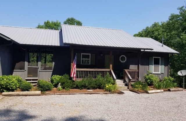 Cozy lake house with fire pit and lake access in backyard