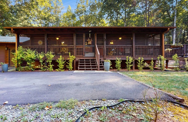 Cozy log cabin with hot tub, fire pit, and scenic screened porches