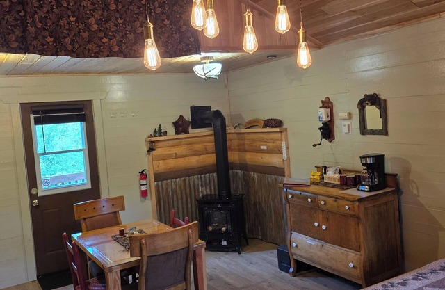 Cozy one room cabin and outhouse tucked in the woods with your own private site.