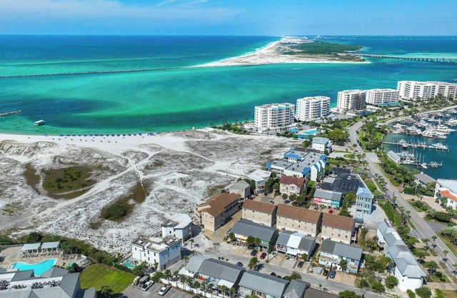 Crimson Cottage nestled between sugary white beaches and Destin Harbor