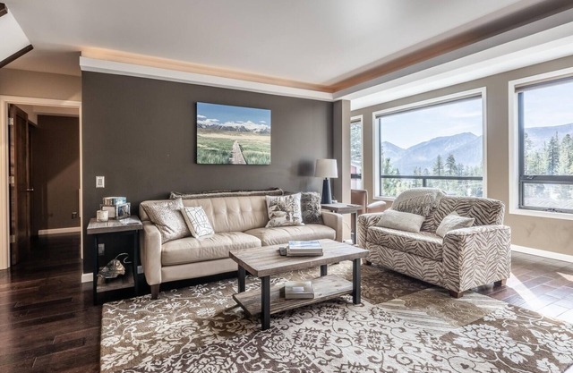 DELUXE SLOPESIDE Condo with 4th FLOOR VIEWS, Elevator and Underground Parking at Canyon Lodge (1849 Condos 409) by RedAwning