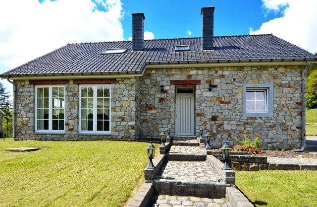 Detached natural stone house with sunny garden and terrace, modern interior