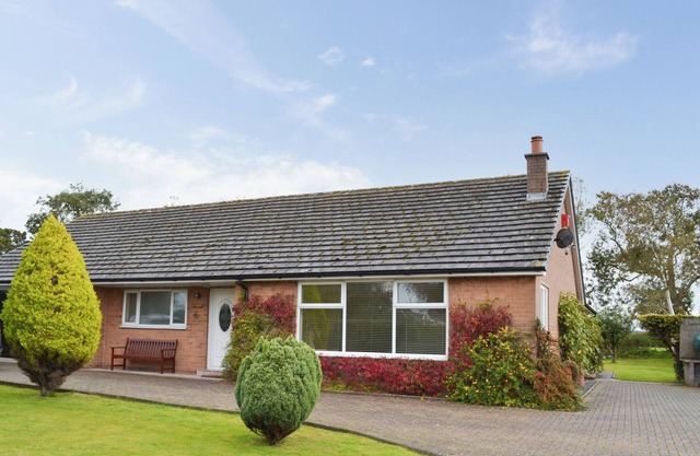 Detached bungalow within extensive private garden.