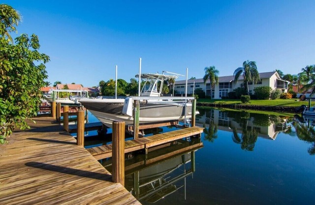Direct water access! Watch the dolphins and manatees in the back yard.