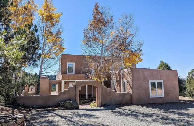 Dog-friendly home on 11 acres overlooking nt'l forest with fireplaces & patio