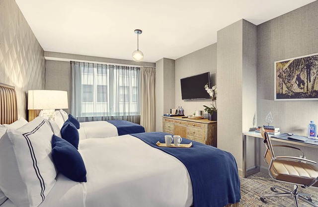 Elegant and Spacious Room with Two Queen Beds for Ultimate Relaxation