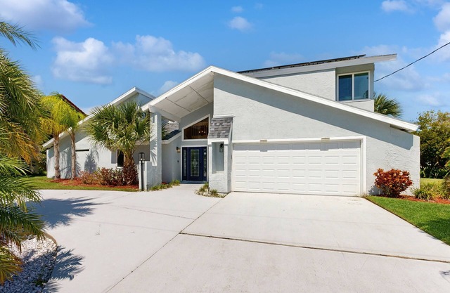 Elegant sound view home with enclosed pool, dock, pool table, fireplace, & grill