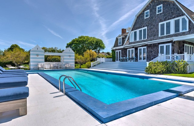 Elegant Watefront home with Oversized Gunite Heated Pool, Tennis, Living.