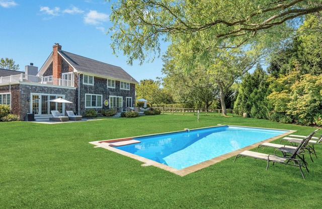 Elegant Water Mill retreat with heated pool, terraces, and timeless.