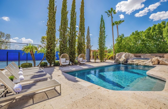 Experience luxury in Central Scottsdale with heated pool, sports court, & slide!