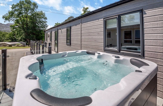 Experience ultimate luxury with the brand-new Faraday lodge with hot tub.
