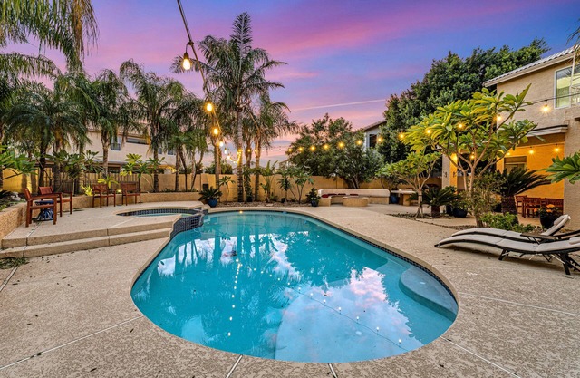Exquisite home with firepit, game room, heated pool, pool spa, & putting green