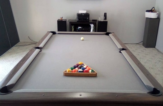 Fun House 2 with a Pool table on main floor game room with walk out patio door.