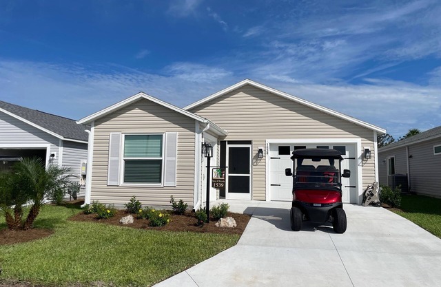 Golf & water views meet fresh style in this brand-new Florida retreat!