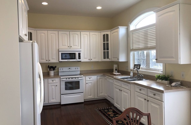 Gorgeous Edgewater home with in-law apartment has beautiful wood floors, high ceilings and crown molding throughout.