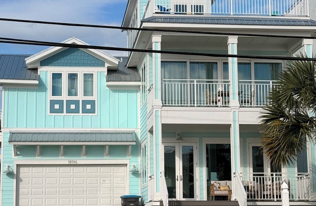 Gorgeous home with unobstructed gulf views, 3 balconies and large front porch.