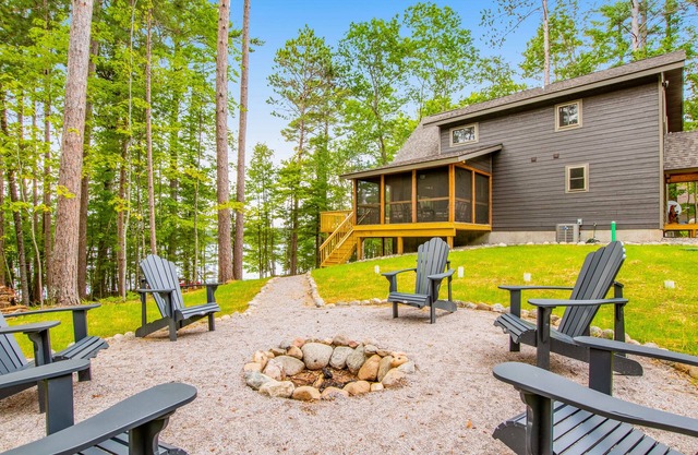 Gorgeous lake home with private pier, beach, firepit, deck, & grill + water toys