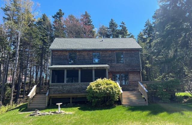 Great Location! Expansive deck with huge yard! Well maintained path to the rocky shoreline.