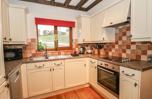 HAZEL LODGE, pet friendly, with hot tub in Washford