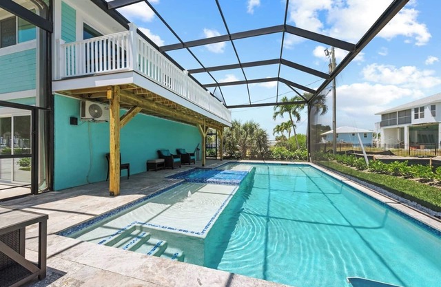 Heated Pool Home steps to the beach
